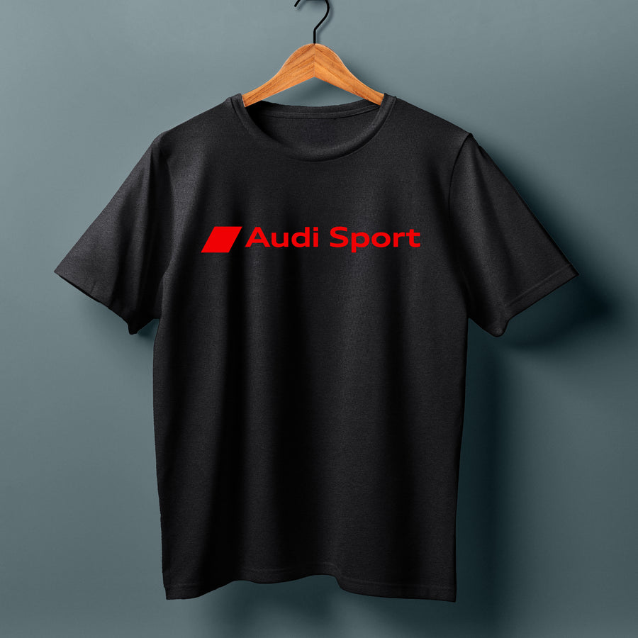 Black T-shirt with a red Audi Sport chest logo, displayed on a wooden hanger.